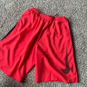 Men’s red Nike dri fit shorts